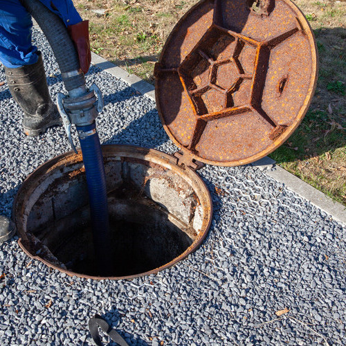 The clearing service is checking the sewer to make sure it is not clogged